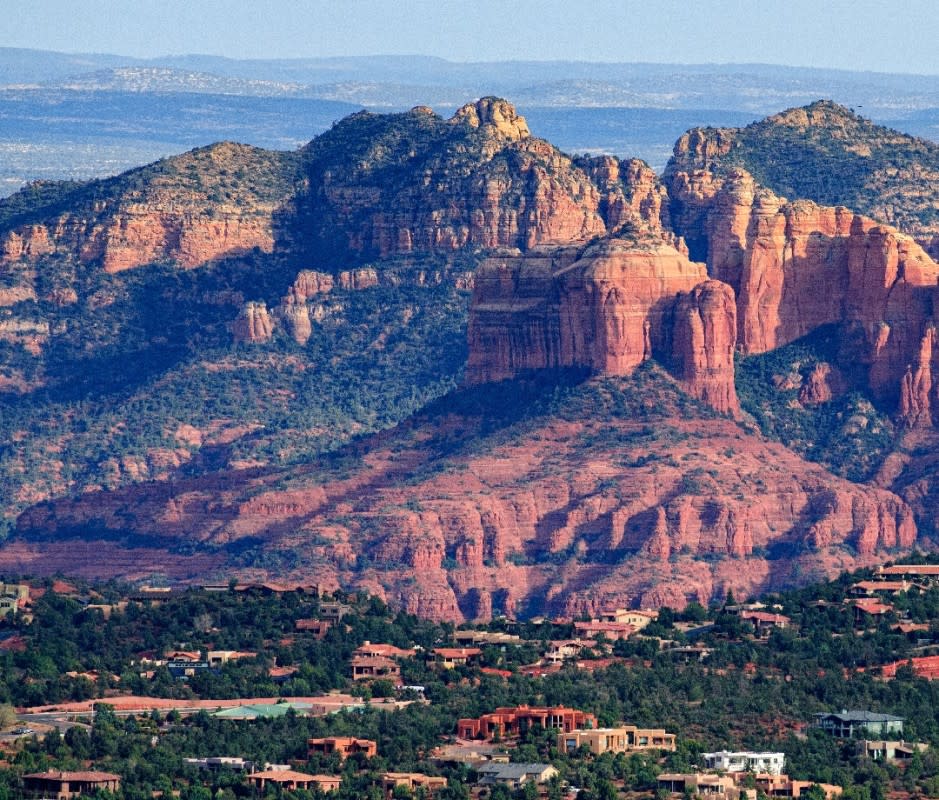 <em>Sedona’s iconic red rock walls—comprised of numerous layers of iron-rich stone—date back millions of years. </em><p>AdventurePhoto/Getty</p>