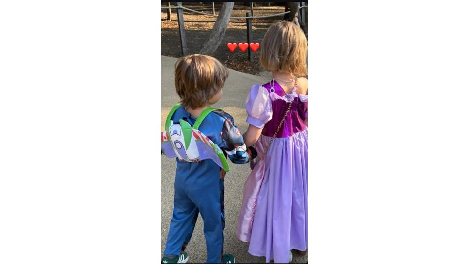 A photo of Coco and Beau Williams holding hands