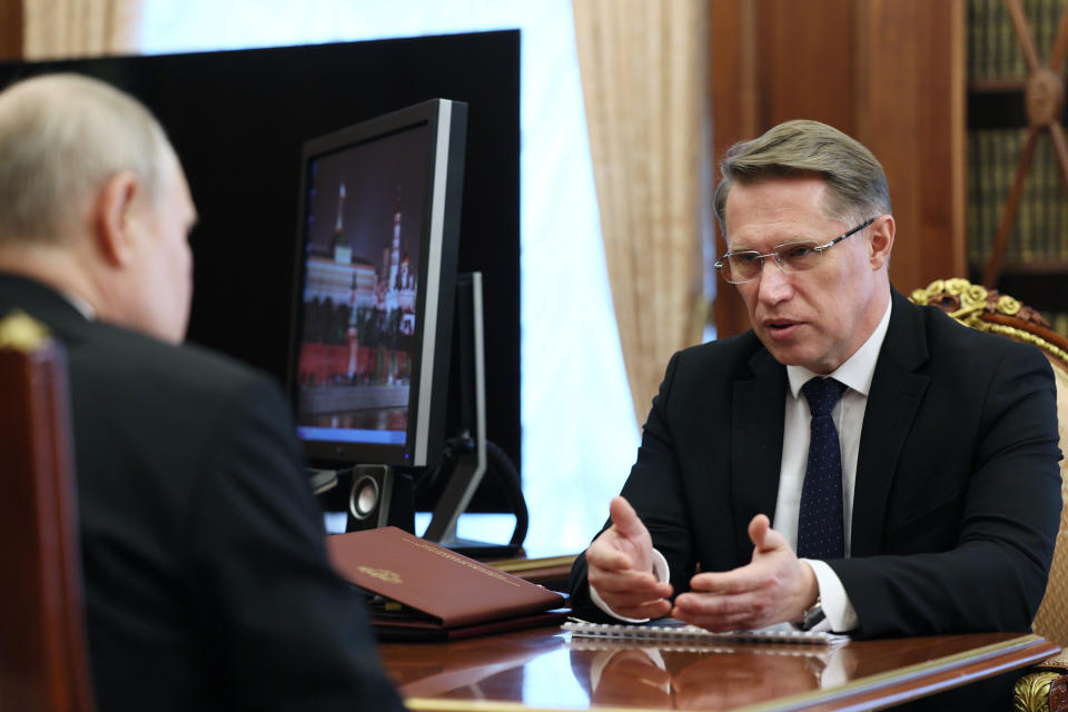 FILE - Russian President Vladimir Putin, left, meets with Russian Health Minister Mikhail Murashko in Moscow, Russia, Wednesday, July 12, 2023. Although abortion in Russia is still legal and widely available, new restrictions are being considered as Putin takes an increasingly socially conservative turn and seeks to reverse the country's declining population. (Alexander Kazakov, Sputnik, Kremlin Pool Photo via AP, File)