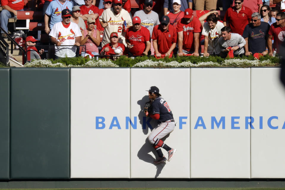 Atlanta Braves' Ronald Acuna Jr. (13) catches a ball hit by St. Louis Cardinals' Dexter Fowler during the fifth inning in Game 4 of a baseball National League Division Series, Monday, Oct. 7, 2019, in St. Louis. (AP Photo/Charlie Riedel)