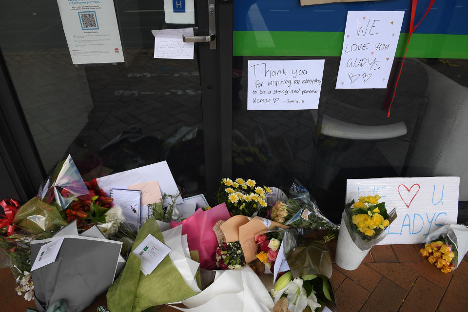 A pile of flowers along with messages outside Gladys Berejiklian's office in Sydney.