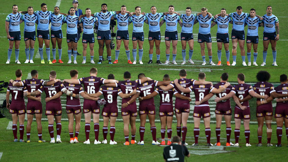 NSW and Queensland players, pictured here during the national anthem at State of Origin.