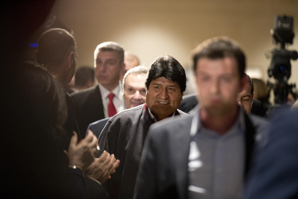 Bolivian President Evo Morales, center, arrives with Greece's Prime Minister Alexis Tsipras, for a press conference in Athens, Thursday, March 14, 2019. Morales is in Greece on a two-day official visit. (AP Photo/Petros Giannakouris)