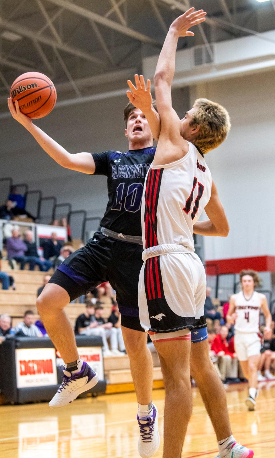 Bloomington South's Aiden Schmitz (10) shoots over Edgewood's Jacob Boggs (11) during the Bloomington South versus Edgewood boys basketball game at Edgewood High School on Tuesday, Nov. 22, 2022.