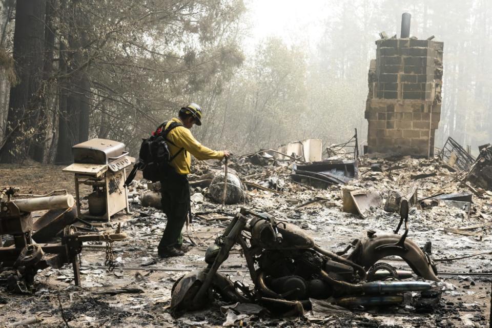 <div class="inline-image__caption"><p>A firefighter works through the remains of a burned-out house on September 14, 2020 in Estacada, Oregon. </p></div> <div class="inline-image__credit">Nathan Howard/Getty</div>