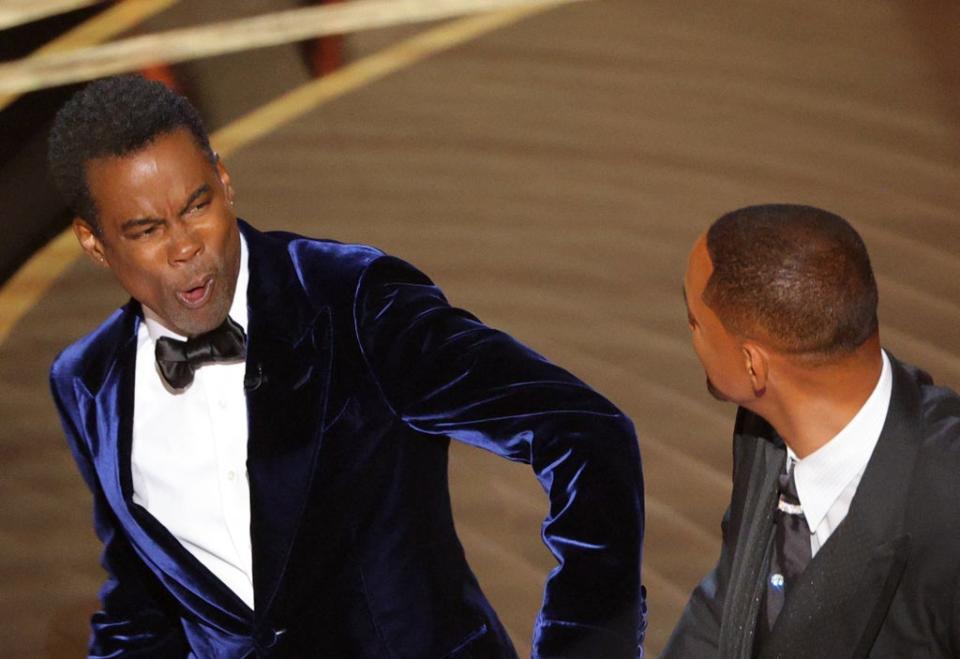 Will Smith slaps Chris Rock on stage at the 2022 Oscars (Reuters)