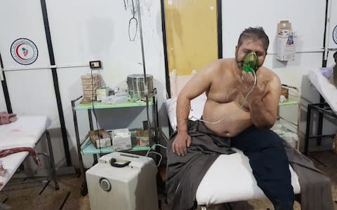 A Syrian man receives medical treatment after Assad regime forces conducted poisonous gas attacks on Duma - Credit: Andalou