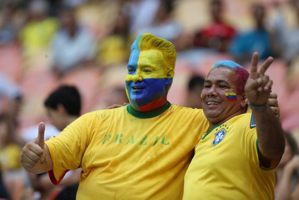 <p>Fans of Colombia and Sweden pose for a photo during a group B match of the men’s Olympic football tournament between Sweden and Colombia at the Amazonia Arena, in Manaus, Brazil, Thursday, Aug. 4, 2016. (AP Photo/Michael Dantas) </p>