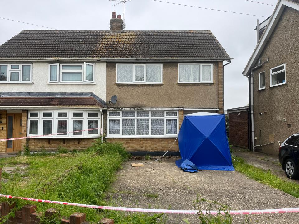 A blue forensic tent outside the entrance to the home (William Warnes/PA Wire)