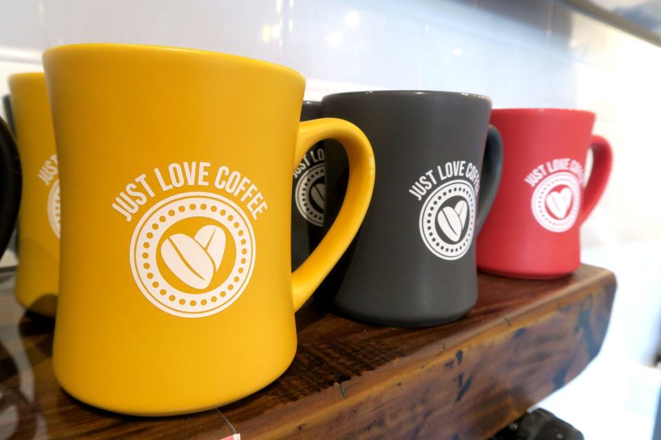 Mugs for sale at the Just Love Coffee Cafe on Broad Street in Matawan, New Jersey, on Aug. 17, 2022.