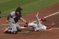 Miami Marlins catcher Jorge Alfaro tags out St. Louis Cardinals center fielder Dylan Carlson during the third inning of a baseball game Monday, June 14, 2021, in St. Louis. (AP Photo/Joe Puetz)