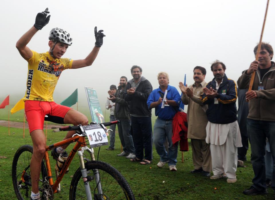 Slovakia's cyclist Martin Haring celebrates after winning all three stages at the end of the Himalayas 2011 International Mountainbike Race in the mountainous area Shugran in Pakistan's tourist region of Naran in Khyber Pakhtunkhwa province on September 18, 2011. AFP PHOTO / AAMIR QURESHI (Photo credit should read AAMIR QURESHI/AFP/Getty Images)
