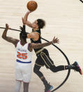 Atlanta Hawks' Trae Young (11) shoots and is fouled by New York Knicks' Reggie Bullock (25) during the first half in Game 4 of an NBA basketball first-round playoff series Sunday, May 30, 2021, in Atlanta. (AP Photo/Brynn Anderson)