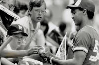 August 1, 1989: Blue Jays right fielder Junior Felix signs autographs for young fans before a game against the Kansas City Royals at SkyDome. (Photo by Ron Bull/Toronto Star via Getty Images)