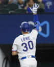 Texas Rangers' Nate Lowe celebrates a solo home run during the seventh inning of a baseball game against the Oakland Athletics, Wednesday, June 23, 2021, in Arlington, Texas. Texas won 5-3. (AP Photo/Brandon Wade)