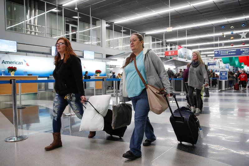 Travelers queue during the Thanksgiving holiday travel rush at O'Hare Airport in Chicago