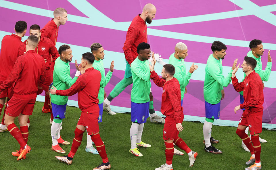 Brazil and Serbia players, pictured here greeting each other before their World Cup clash.