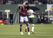 Portland Timbers midfielder Yimmi Chara, right, collides with Colorado Rapids' Auston Trusty on a header during an MLS soccer match, Wednesday, Sept. 15, 2021 in Portland, Ore. (Sean Meagher/The Oregonian via AP)