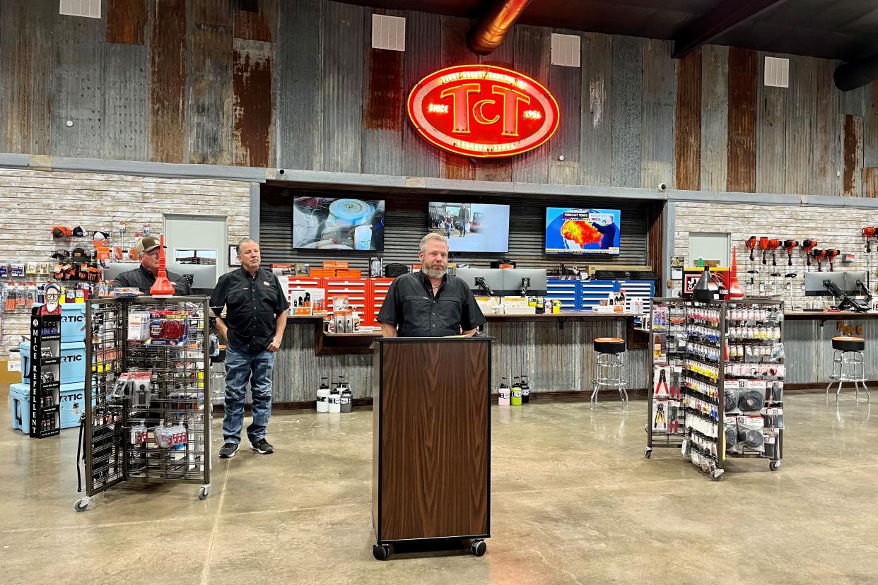 Shane Melcher, general manager of Terry County Tractor, announces his business's partnership with the Lubbock County Expo Center while LCEC treasurer Bret Lamkin looks on on Thursday.