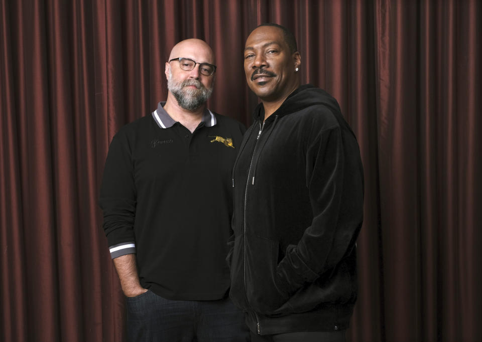 FILE - This Sept. 7, 2019 file photo shows Eddie Murphy, right, star of the film "Dolemite Is My Name," with director Craig Brewer at the Shangri-La Hotel during the Toronto International Film Festival in Toronto. (Photo by Chris Pizzello/Invision/AP, File)