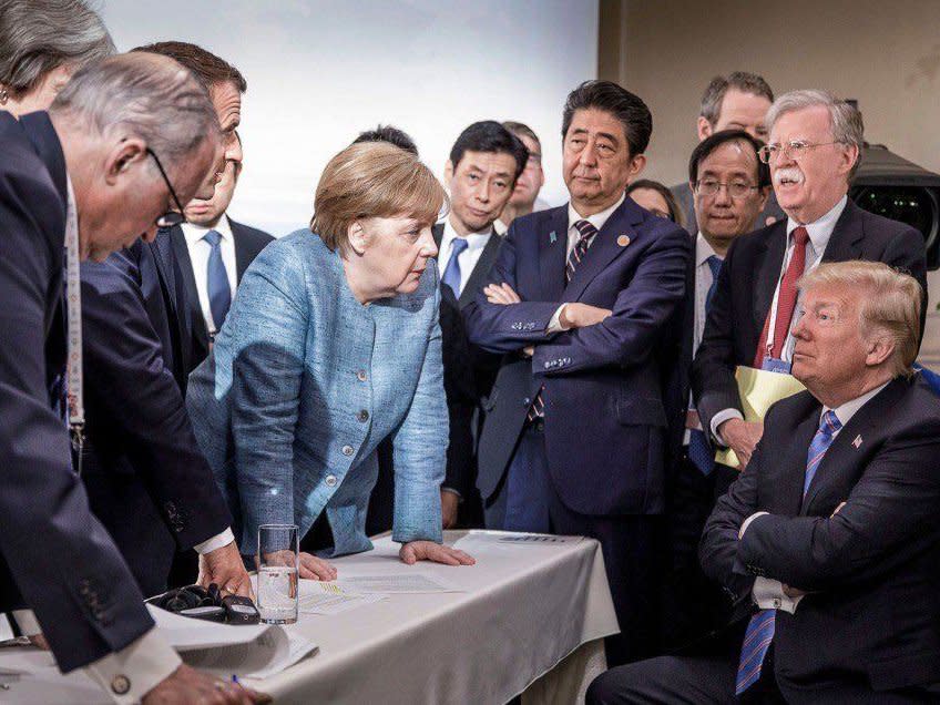 World leaders surround a seated Donald Trump at the G7 summit: Jesco Denzel