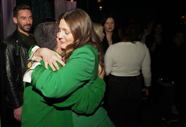 Drew Barrymore hugs friend and designer Christian Siriano at the launch of her Grove Co. Fresh Horizons collection in New York City last month.