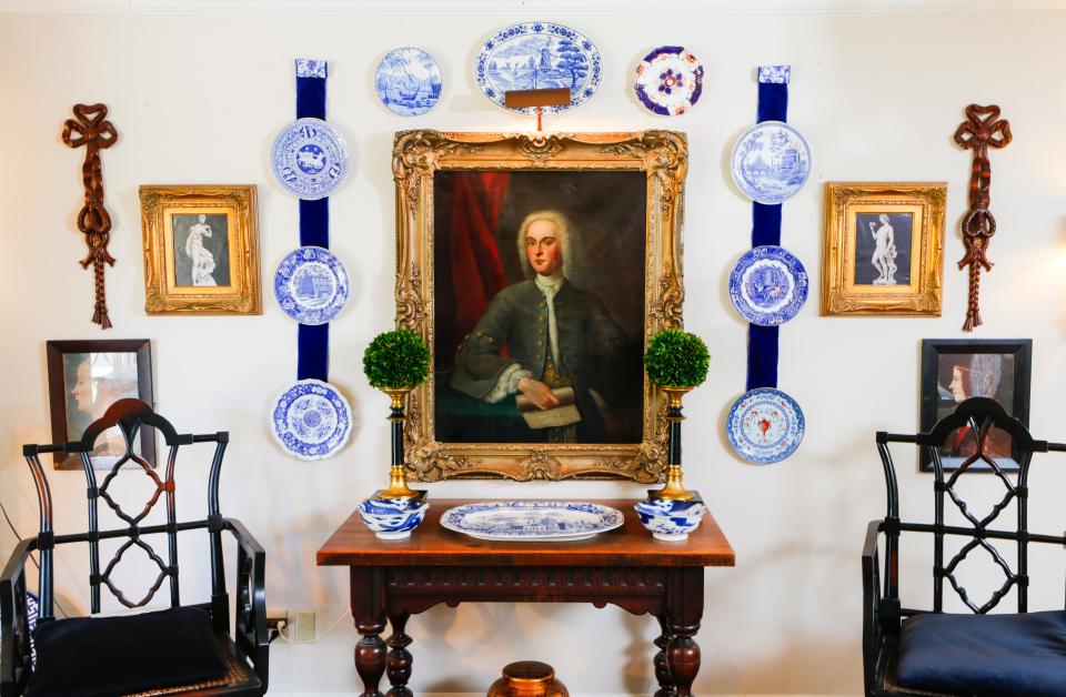 "Always make it comfortable; don't get carried away with the antiques or the beautiful things. Sometimes they are just to look at," says Rick Morehead, on his decorating style. An English-style portrait hangs in the living room. July 10, 2023.