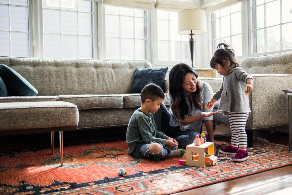 Mother playing with kids at home