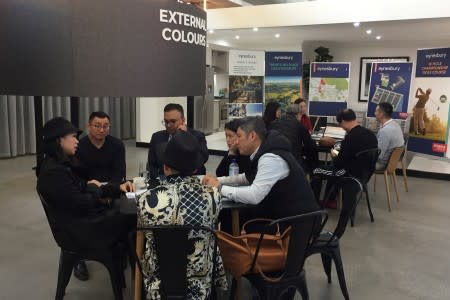 Investors from Hong Kong visit a Tick Homes display centre during a property tour in Melbourne