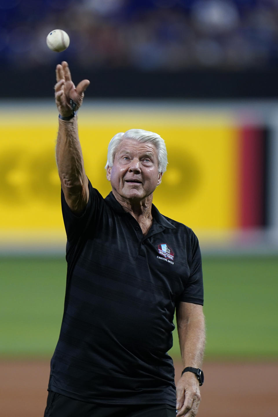 Pro Football Hall of Fame coach Jimmy Johnson throws out a ceremonial first pitch before the start of the first game of a baseball doubleheader between the Miami Marlins and the Atlanta Braves, Saturday, Aug. 13, 2022, in Miami. (AP Photo/Wilfredo Lee)