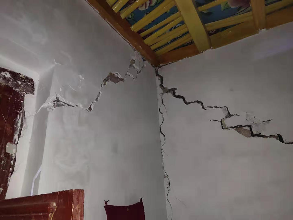 In this photo released by China's Xinhua News Agency, cracks are seen after an earthquake in the walls of a home in Jiashi County of Kashgar prefecture in northwestern China's Xinjiang Uighur Autonomous Region, Monday, Jan. 20, 2020. A strong earthquake has damaged buildings and injured at least one person seriously in China's far west Xinjiang region. (Li Chengxin/Xinhua via AP)