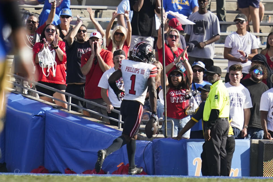 Utah cornerback Clark Phillips III (1) runs to the endzone for a touchdown after intercepting a pass during the second half of an NCAA college football game against UCLA in Pasadena, Calif., Saturday, Oct. 8, 2022. (AP Photo/Ashley Landis)