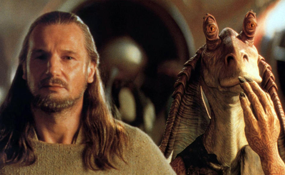 Liam Neeson looking annoyed at Jar Jar Binks.