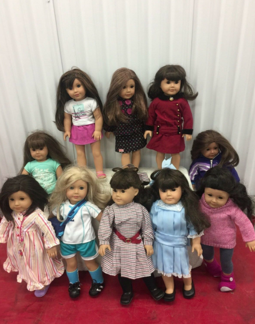 A collection of 10 American Girl dolls 