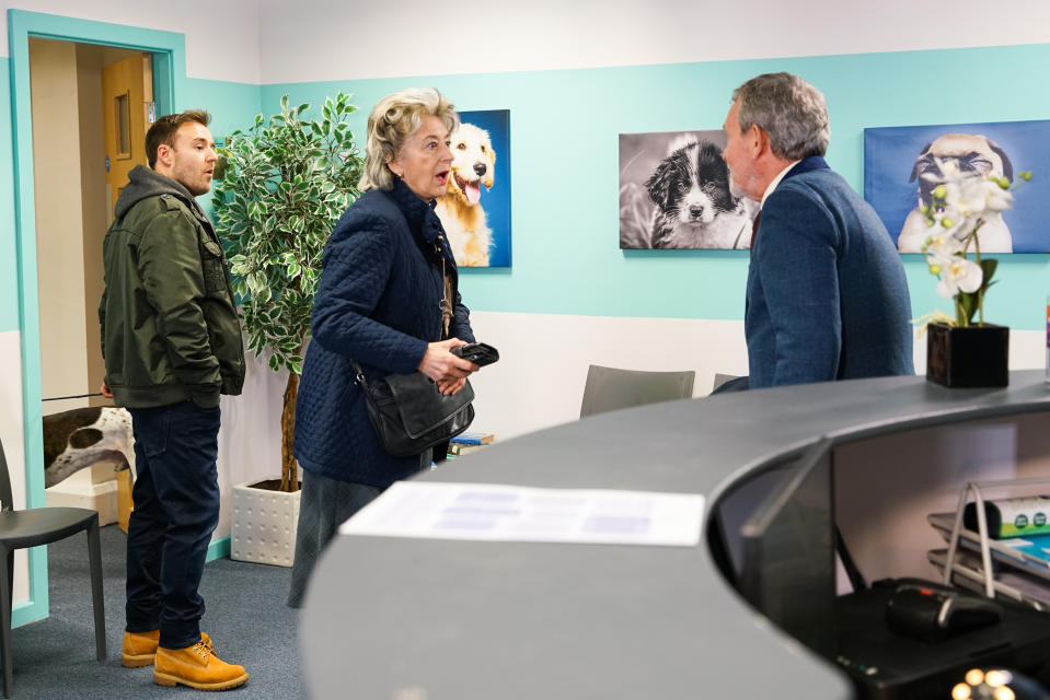 Evelyn Plummer [MAUREEN LIPMAN] and Tyrone Dobbs [ALAN HALSALL] take Cerberus to the vets. As Evelyn pays the bill, she's taken aback when her old flame Arthur Medwin [PAUL COPLEY] enters the surgery with his cockapoo.  Tyrone watches in amusement at their interaction
(ITV Plc)