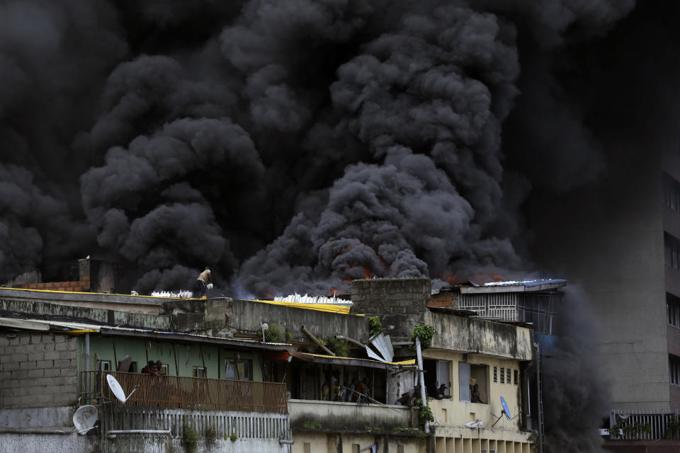 Smoke rises from a fire in downtown Lagos, Nigeria, Tuesday, Nov. 5, 2019. (Photo: Sunday Alamba/AP)