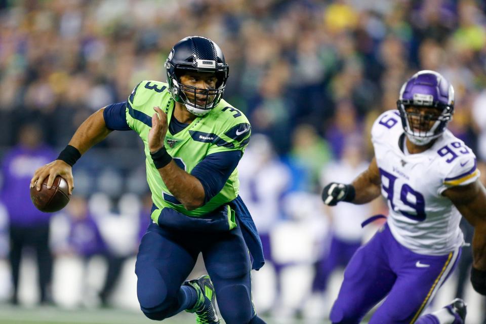Russell Wilson scrambles out of the pocket during a 27-26 win against the Minnesota Vikings on Oct. 11, 2020.