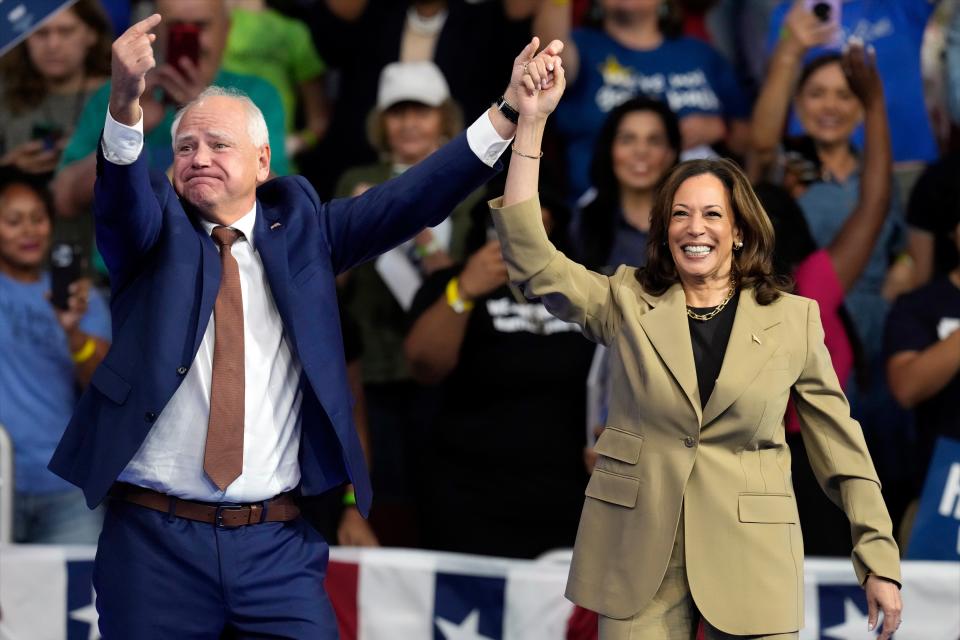 Democratic presidential nominee Vice President Kamala Harris and running mate Minnesota Gov. Tim Walz arrive at a campaign rally at Desert Diamond Arena, Friday, Aug. 9, 2024, in Glendale, Arizona (AP)