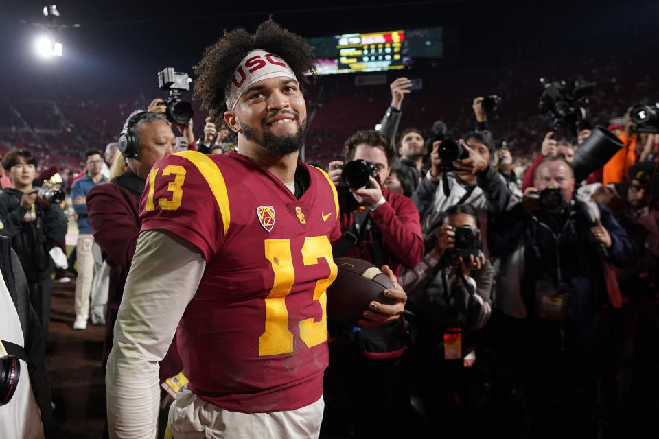 FILE - Southern California quarterback Caleb Williams smiles after USC defeated Notre Dame 38-27 in an NCAA college football game Saturday, Nov. 26, 2022, in Los Angeles. Southern California quarterback Caleb Williams was named the AP Player of the Year in college football, Thursday, Dec. 8, 2022. (AP Photo/Mark J. Terrill, File)