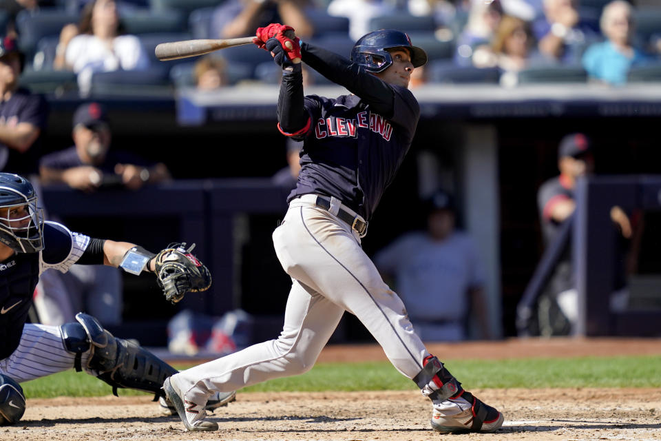 Cleveland Indians' Andres Gimenez hits a three-run home run off New York Yankees relief pitcher Albert Abreu in the fifth inning of a baseball game, Saturday, Sept. 18, 2021, in New York. (AP Photo/John Minchillo)