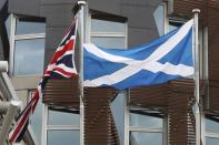 The Union Flag and The Saltire fly outside the Scottish Parliament in Holyrood Edinburgh, Scotland March 13, 2017. REUTERS/Russell Cheyne