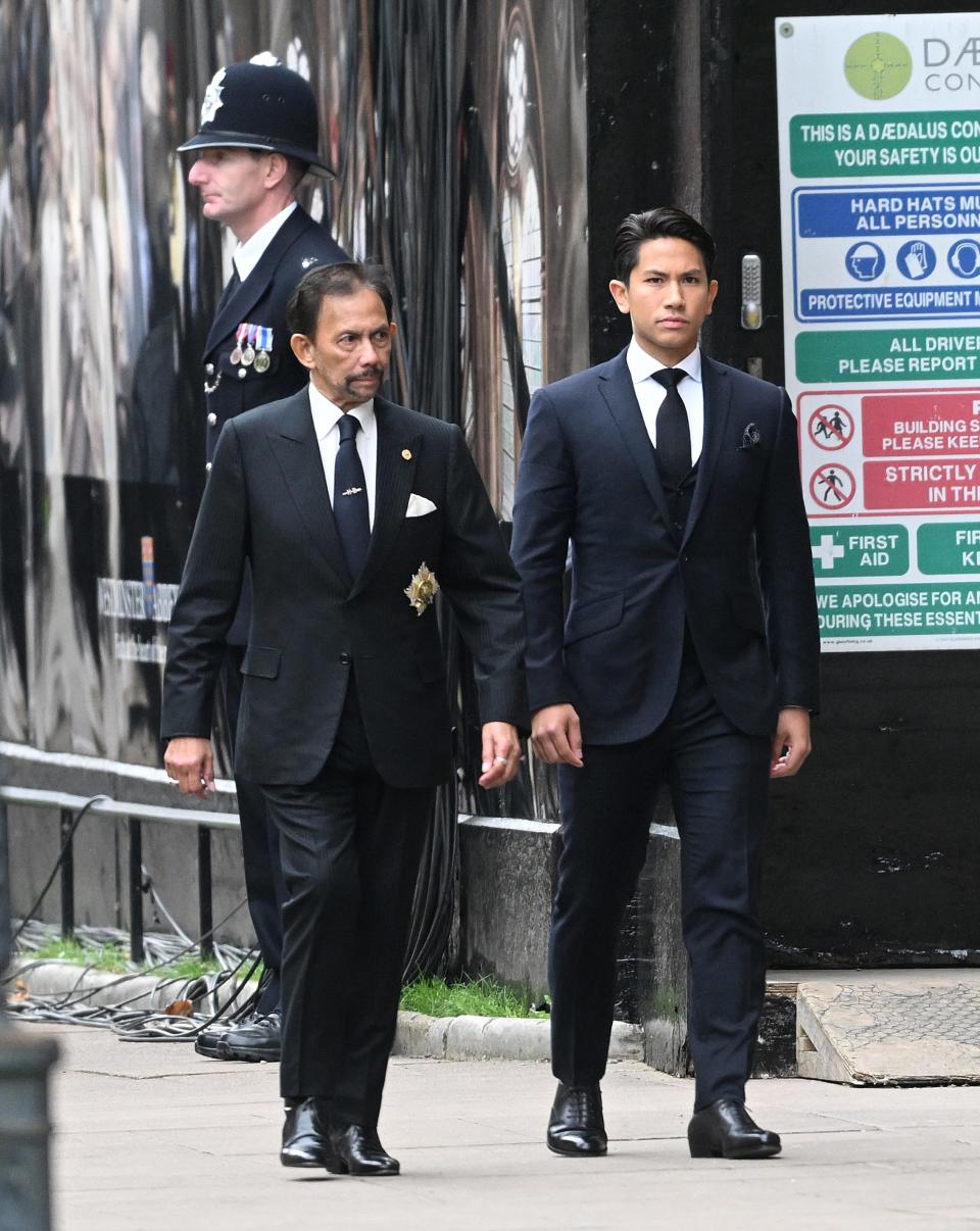 Sultan of Brunei Hassanal Bolkiah and Prince Abdul Mateen arrive for the State Funeral of Queen Elizabeth II at Westminster Abbey on September 19, 2022 in London, England.