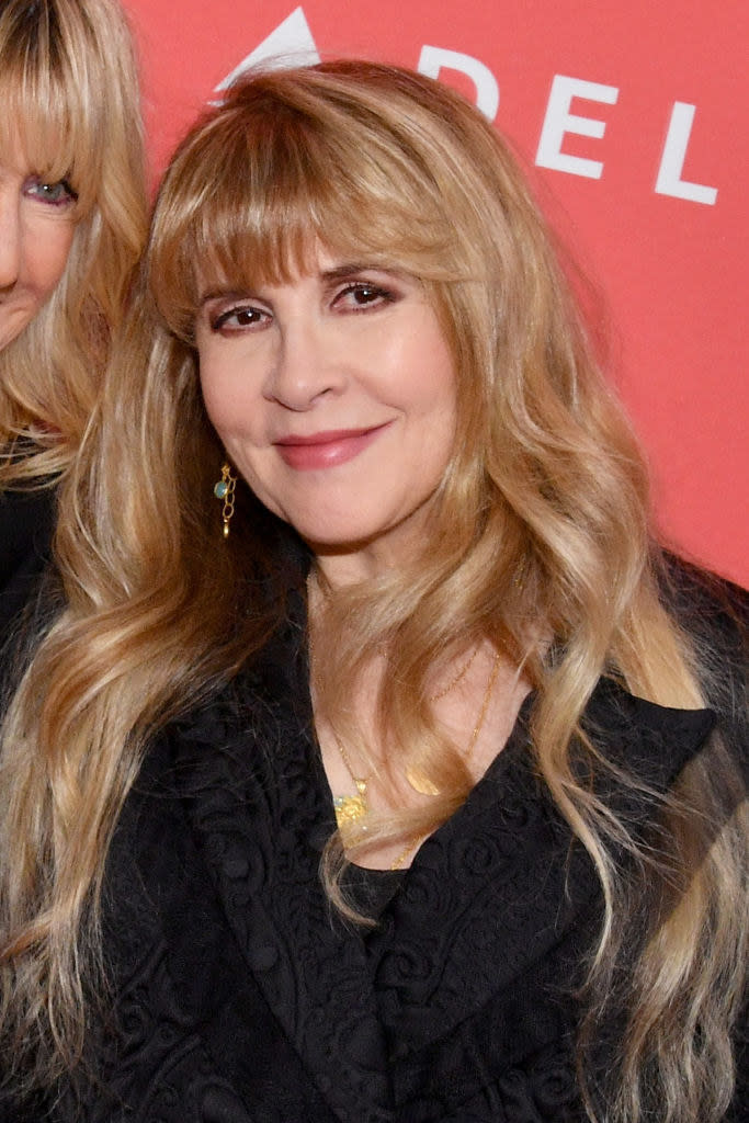 Nicks smiling at a MusiCares Person of the Year event for Fleetwood Mac in 2018