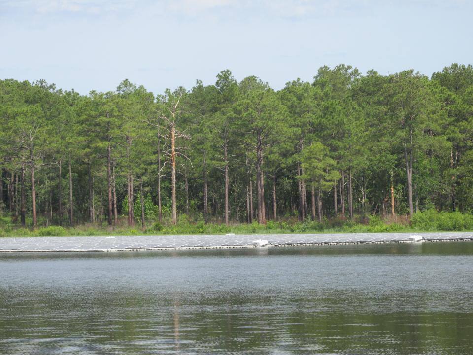 Solar panels on nearly 2 surface acres of Big Muddy Lake at Camp Mackall are part of a clean energy project collaboration between Fort Bragg, Duke Energy and Ameresco and is the first project of its kind for the Department of Defense.