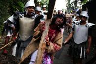 Indonesian Catholics participate in a re-enactment of the crucifixion of Jesus Christ on Good Friday 2010 in Yogyakarta, Indonesia. At the last count in 2000 Catholics make up just over three percent of the population of the predominantly Muslim country of approximately 6.5 million people.