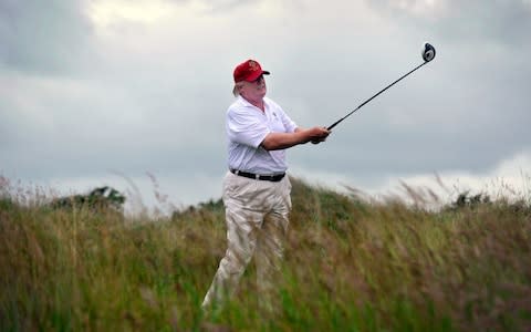 Donald Trump at the Trump International Golf Links course in Aberdeenshire - Credit: Andy Buchanan/AFP