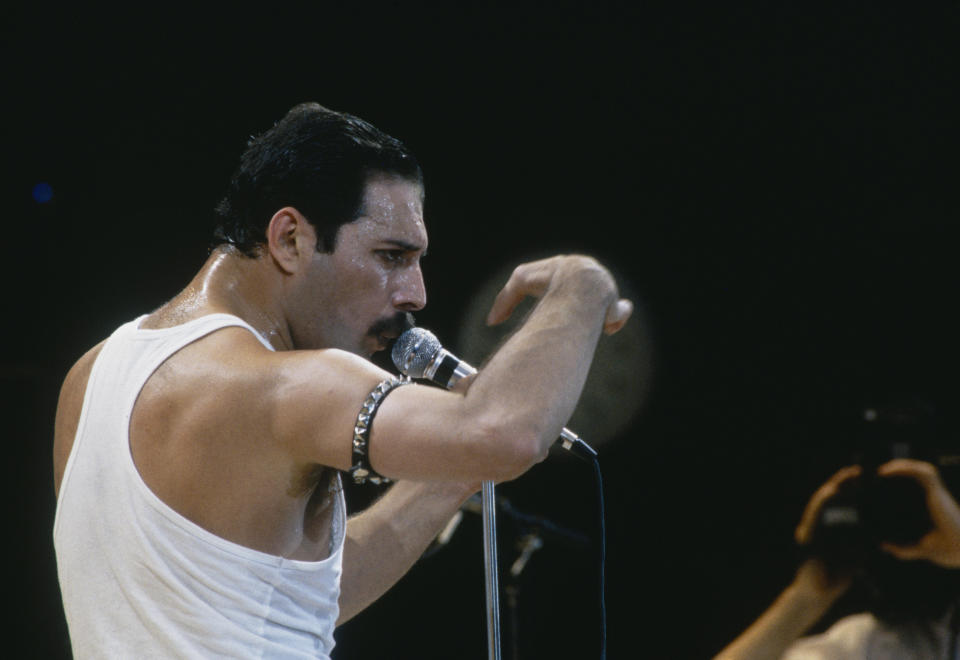 Singer Freddie Mercury of Queen performs during Live Aid at Wembley Stadium on 13 July 1985. (Photo by Dave Hogan/Getty Images)