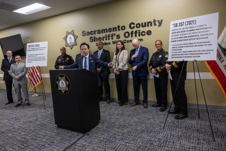 Sacramento County District Attorney Thien Ho speaks at a press conference on Friday announcing the results of a large-scale operation combating human trafficking and childhood prostitution. He is pointing at placards showing two recently passed laws that law enforcement officers said were limiting their ability to arrest traffickers and help victims. “Thirteen years old is the average age of the young girl bought into the world of human trafficking,“ Ho said.