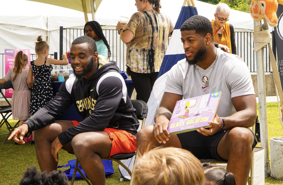 Florida State football players Trey Benson and Jared Verse read to kids at Word of South.
