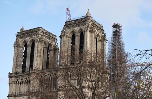 New golden rooster weathervane installed atop Notre Dame Cathedral spire -  CBS News